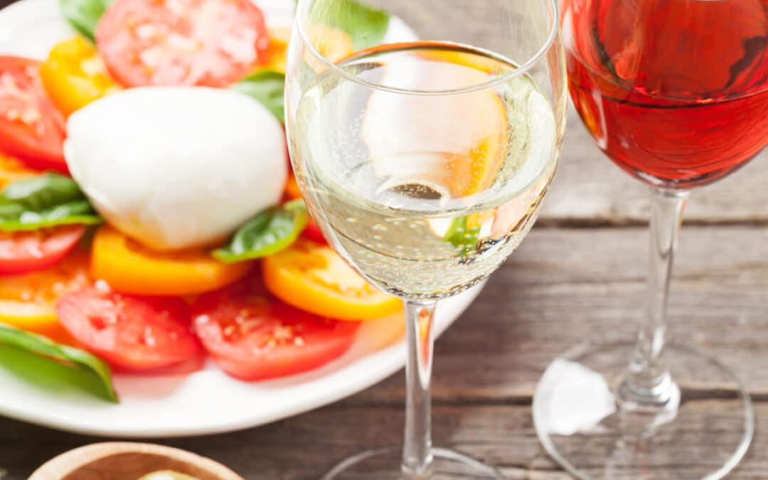 white and rose wine glasses with salad