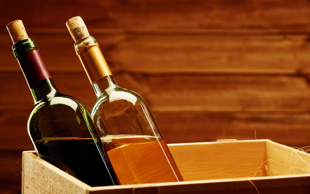 wine bottles sitting in wooden box